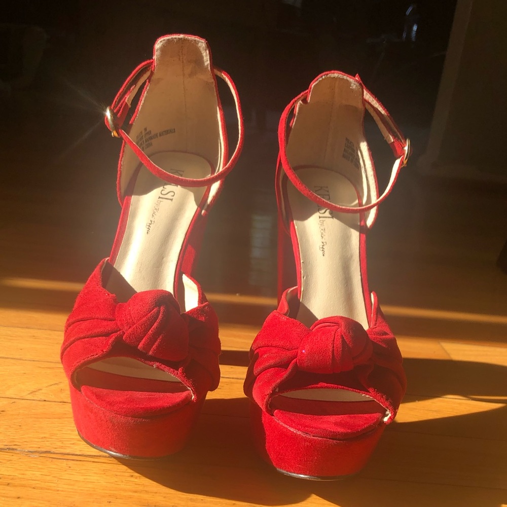 Red suede peep toe bow pumps